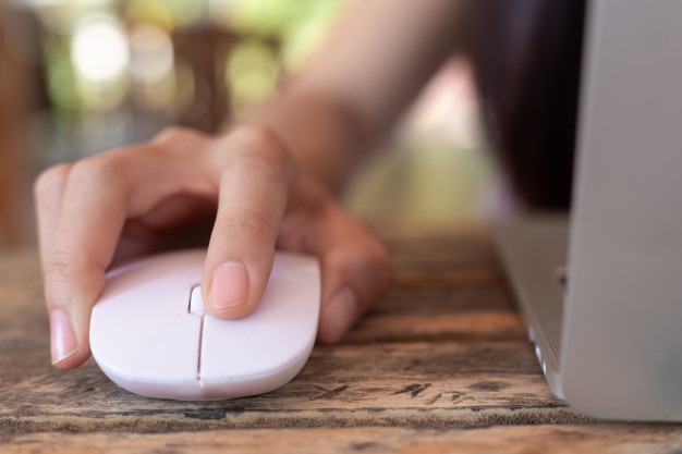 Image of a hand-clicking-on-a-mouse.