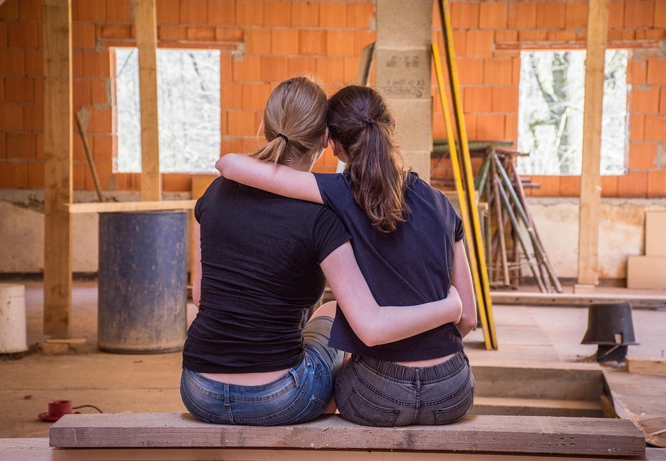 Girls-feeling-happy-at-how-promising-their-home-remodeling-project-looks